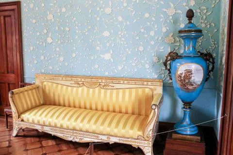 Vase by the sofa. Stock Photos