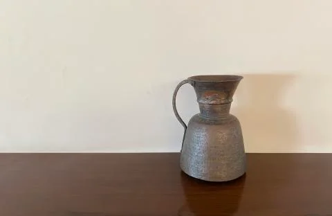 Vase standing on table. Stock Photos