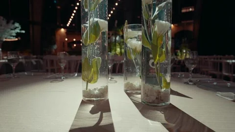 Vases with white flowers on the table in the hall Stock Footage 220609628