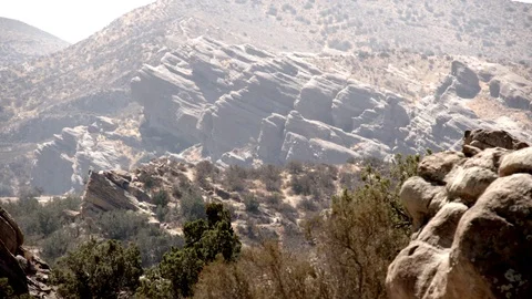 Vasquez Rocks 4K distant hazy rocks ease out V24284 Stock Footage 94737874