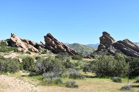 Vasquez Rocks with Mountains in Background Stock Photos