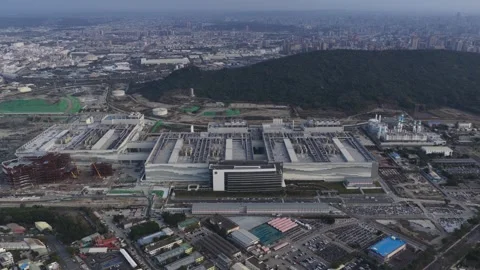 Vast aerial perspective of a cutting edge semiconductor factory, showcasing the Stock Footage 331639537