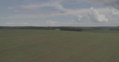 Vast Agricultural Fields Under an Expansive Sky Stock Photos
