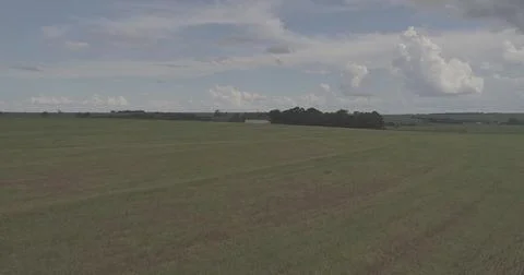 Vast Agricultural Fields Under an Expansive Sky Stock Photos