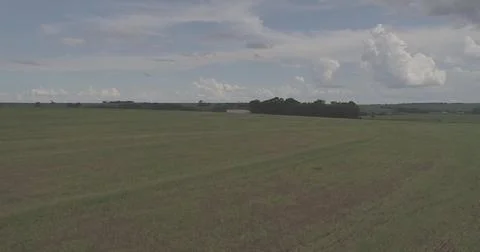 Vast Agricultural Fields Under an Expansive Sky Stock Photos