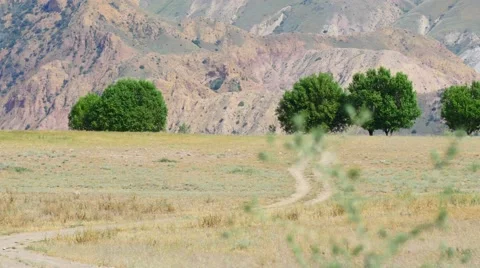Vast and Empty Countryside Path next to Hills Stockbeeldmateriaal 53232805