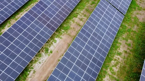 Vast array of Solar farm, photovoltaic power station, flying above, day Stock Footage 287213489