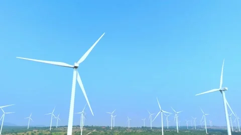 A vast array of towering wind turbines from aerial view drone. Stock Footage 274374939