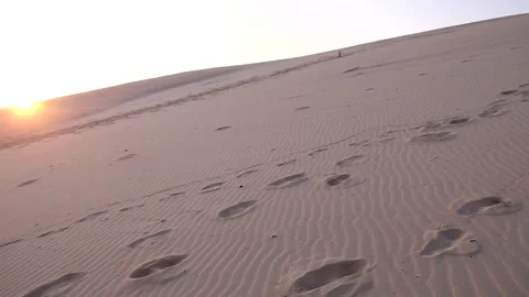 Vast Beach - Footprints on dune Pan to wide of sea in distance Vídeos de archivo 244687262