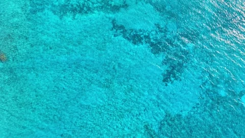 Vast blue ocean background with moderate waves, looking straight down. Video stock 333674909