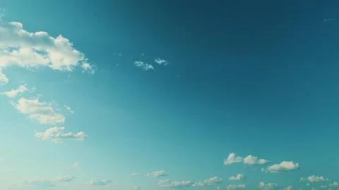 Vast Blue Sky And Clouds. White Curly Clouds In Blue Sky. Beautiful Blue Sky And Stock Photos