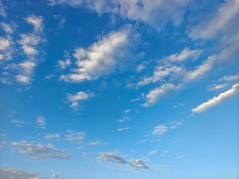 Vast Blue Sky with Light Soft White Clouds Background Stock Photos