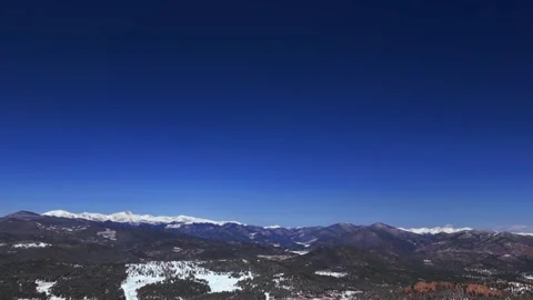 Vast Blue Sky Mountain Snow-covered Peaks landscape Evergreen Mount Blue Sky 스톡 동영상 334116455