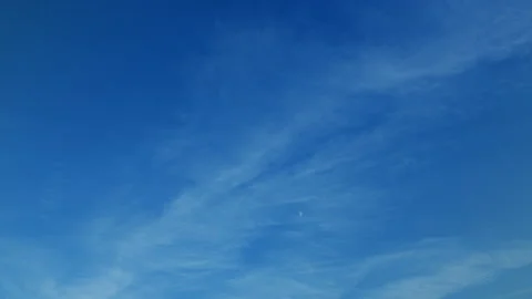 A Vast Clear Blue Sky with Delicate Thin Clouds Gracefully Floating Above, Evoki Stock Footage 314455266