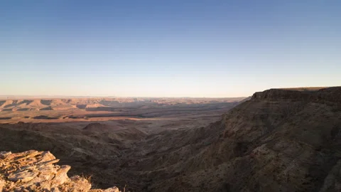 Vast Desert Landscape with Rocky Cliffs Stock Footage 303383055