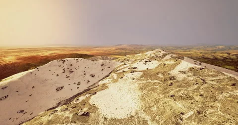 Vast desert landscape showcasing rolling dunes and colorful terrain at dusk Видео 317051439