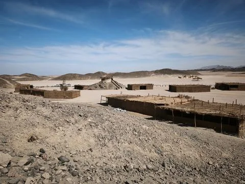 Vast Egyptian desert panorama with rolling sand dunes, rugged rocky terrain.. Stock Photos