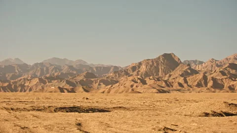 Vast empty desert and distant barren mountains Stock Footage 326228035