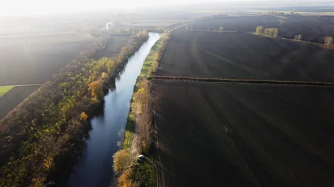 Vast empty fields and trees on a riverbank in autumn sunny day 스톡 동영상 263201762