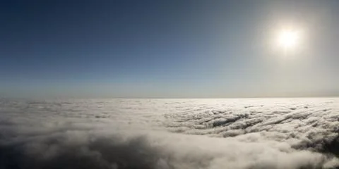 Vast expanse of clouds under a bright sun, seen from above the atmosphere Fotos de archivo