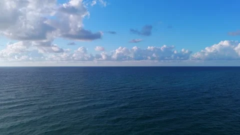 Vast expanse of ocean with clear sky above. Calm water with minimal wave Stock Footage 275906845