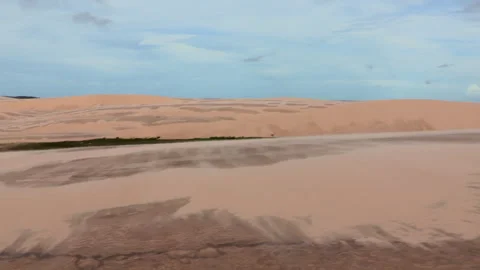 Vast expanse of sand dunes with subtle patterns, set against a backdrop of .. Stock Footage 308327406