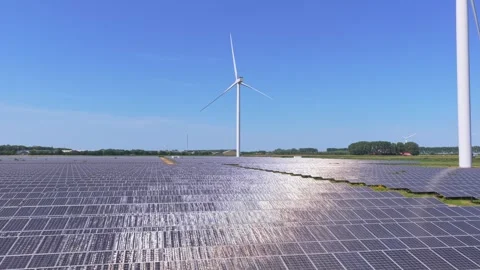 Vast field of solar panels and wind turbines generating clean, renewable 스톡 동영상 345027096