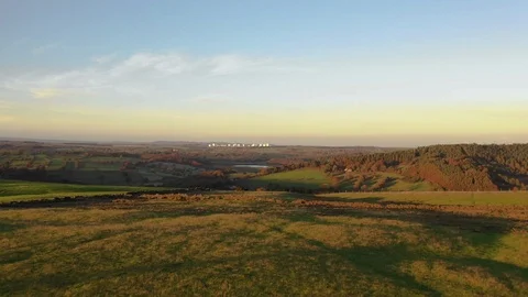 Vast green fields seen from a hill top at sunset Stock-Footage 102187595