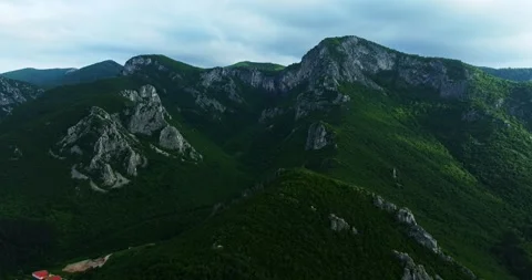 Vast Green Landscape Cliffs Trees Aerial Rise Tilt Down Cinematic Drone Shot Stock Footage 289411894