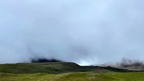 Vast Green Mountain Landscape Under Overcast Sky in Tibet China Stock Footage 339271060