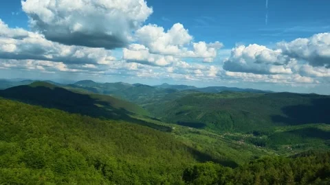 Vast green mountains roll under bright blue skies. Zlatibor Mountain, Serbia. Stock Footage 337123048