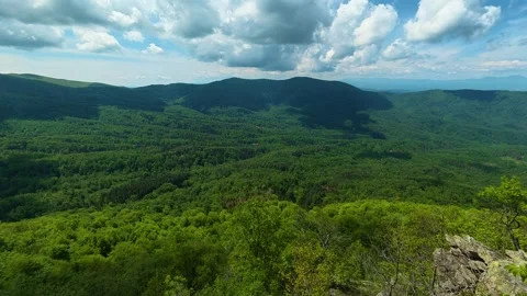 Vast green valleys stretch beneath rolling hills. Jastrebac Mountain, Serbia. Vídeos de archivo 336023481