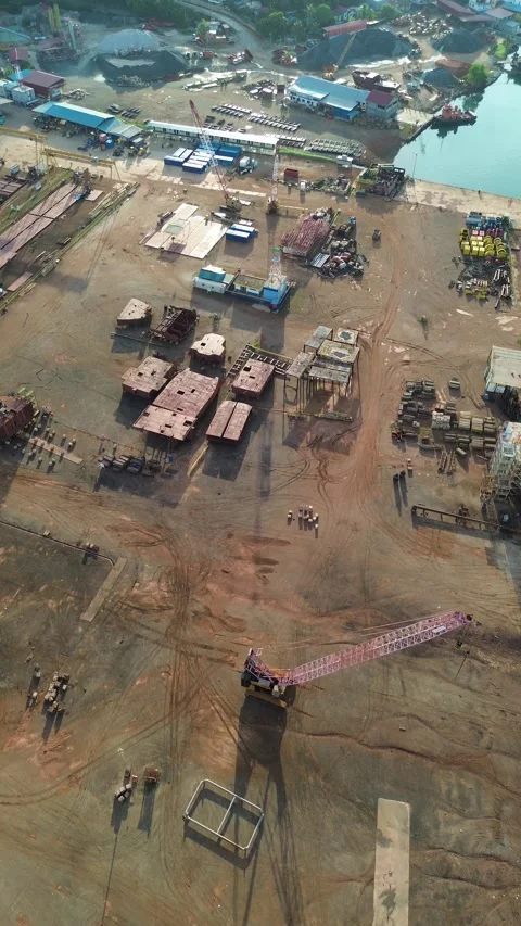 Vast industrial waterfront operations captured from above, revealing extens.. Video stock 337283485