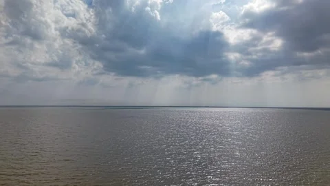 Vast lake under dramatic, brooding clouds Stock Footage 337539539