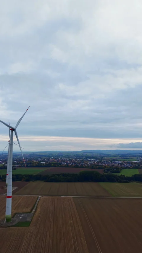 Vast landscape captured from above shows fields and distant hills under an Stock Footage 331403009