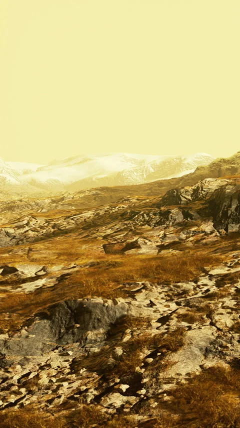 A vast landscape features rocky ground and some grass 库存影片 335692517