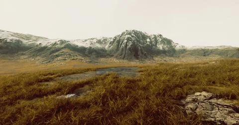 Vast mountain landscape with snow capped peaks under a cloudy sky Ilustração Stock