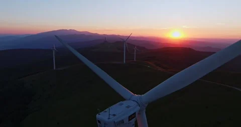 Vast Mountain Peak Landscape Wind Turbine Generators Spinning Vibrant Sunrise Stock Footage 300487474