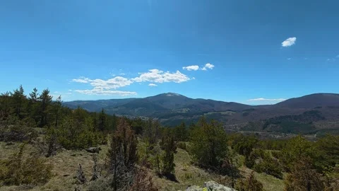 Vast mountain range under clear blue sky. Balkan, Eastern Europe, POV Video stock 333440554