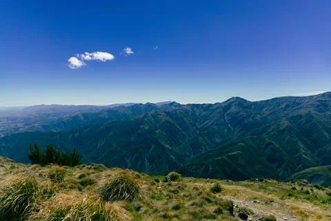 Vast Mountain Range Under Clear Blue Sky 写真素材