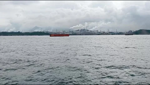 The vast ocean with a backdrop of ship shadows and cloudy mountains Stock Footage 277260095