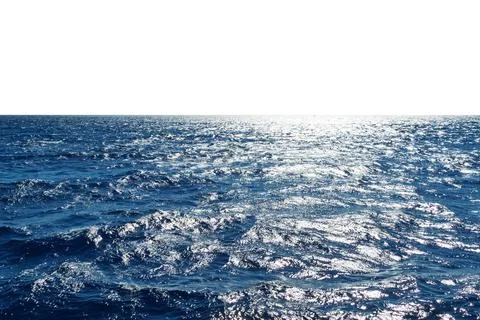 Vast ocean horizon with sunlight reflection and clear blue waters. Isolated.. Stock Photos