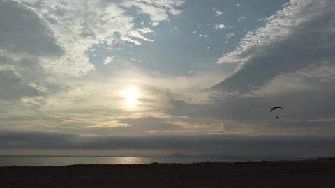Vast ocean sunset with parachute Stock Footage 337790551