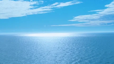 Vast ocean view reflects sunlight on the shimmering water surface Stock Footage 321195981