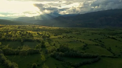 A vast, open field with a beautiful, sunlit sky Stock Footage 327907989