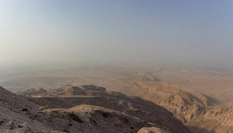 Vast Panoramic View of Deep Desert Canyons and Rugged Mountains Stock Photos