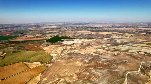 Vast patchwork of Spanish fields and dry riverbeds from above. Stock Footage 257337457