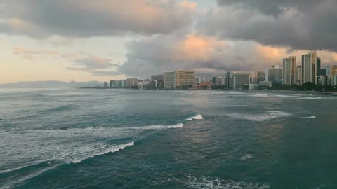 Vast Peaceful Ocean Horizon With Distant Cityscape And Gentle Waves Stock Footage 323562430