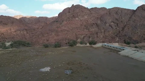Vast Red Rock Formations and a Dam in the Saudi Arabian Desert Stock Footage 320822985