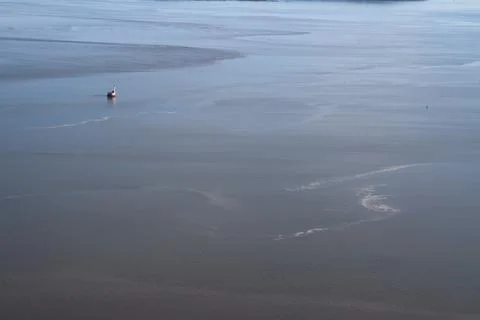 A vast river background with a lighthouse Stock Photos